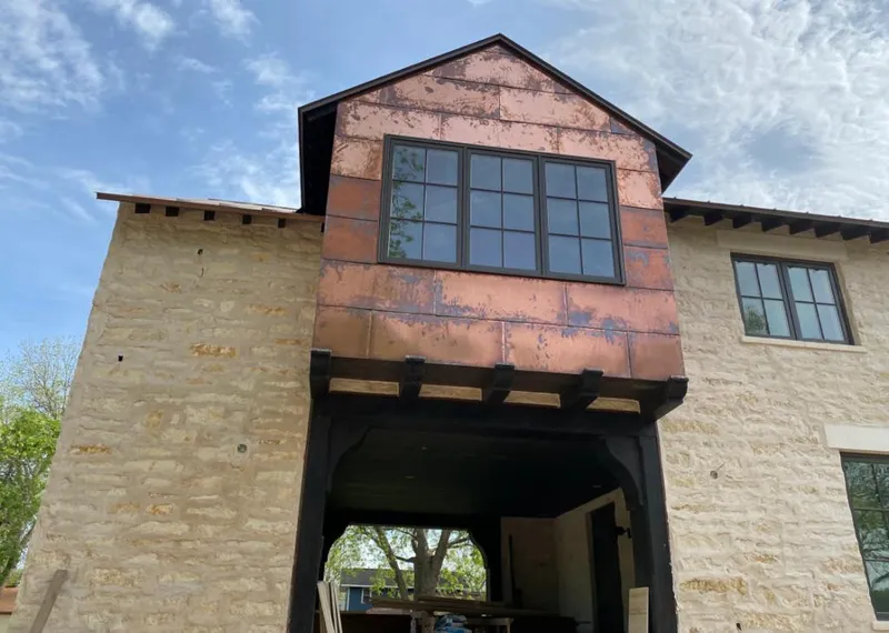Copper metal panel facade on a stone building for Skylight Installation in Fort Lauderdale